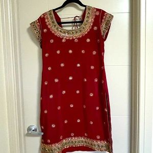 Beautiful red and green suit. Silk material with beautiful design.